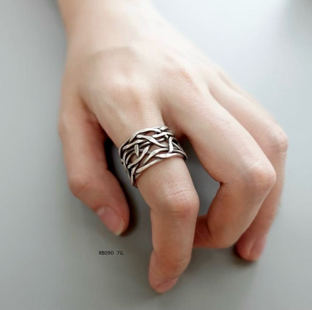 Silver ring. Intricate beauty, echoing mountain traditions.