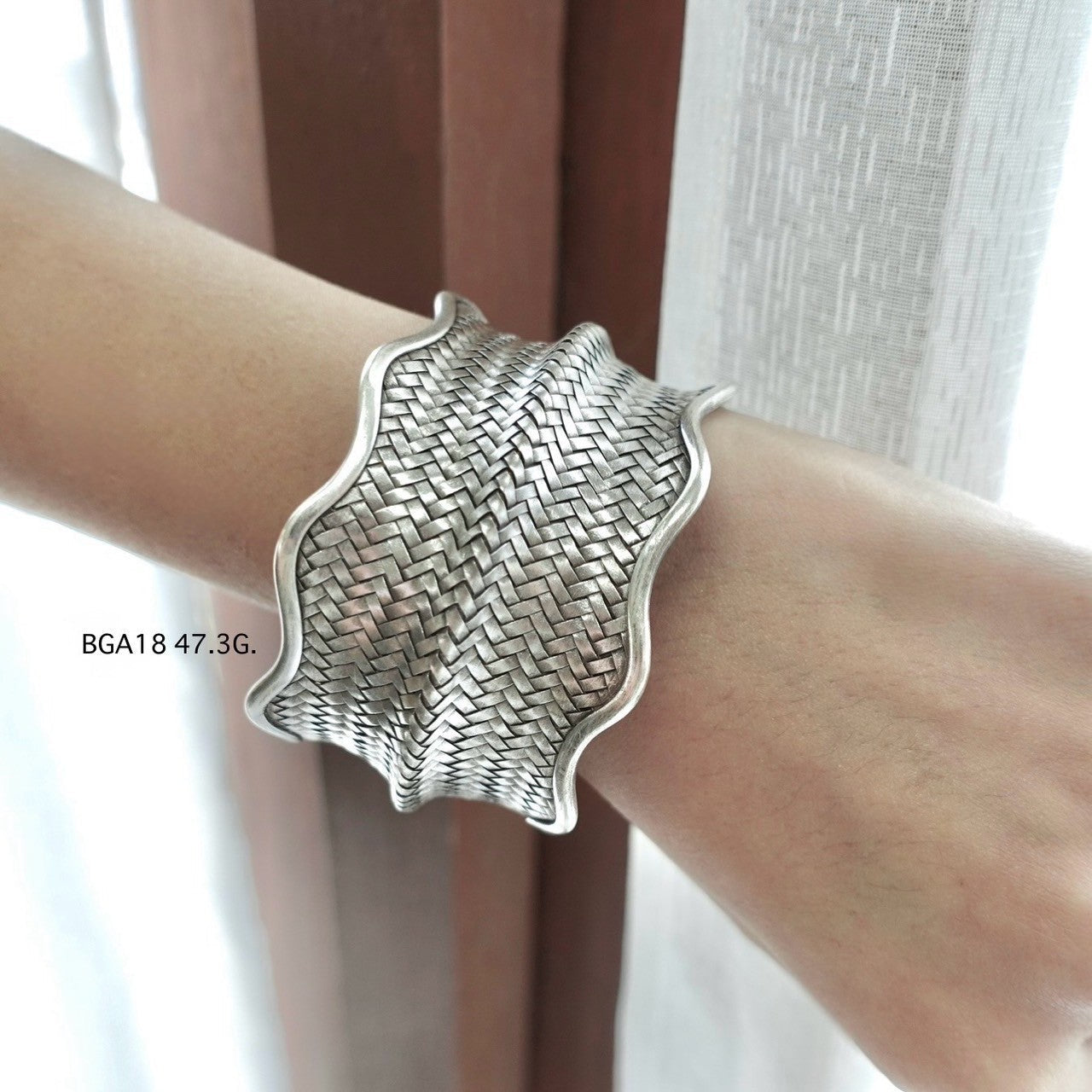 Handmade silver bangle, timeless shine.