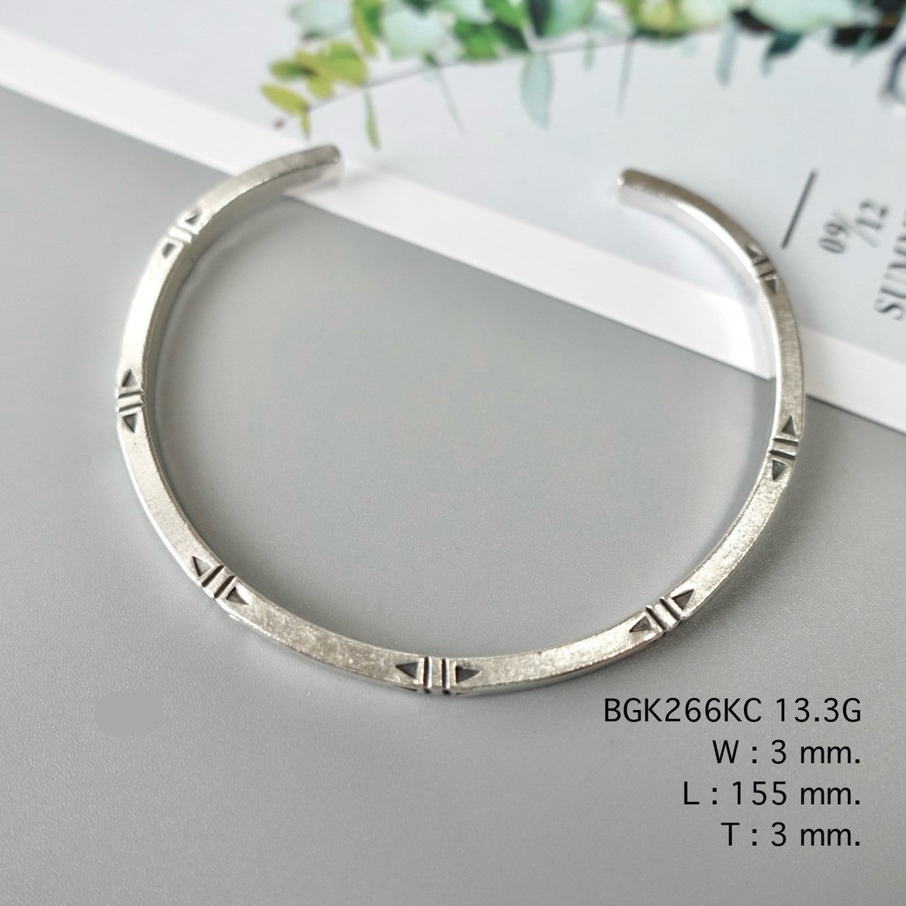 Add grace with a silver bangle.