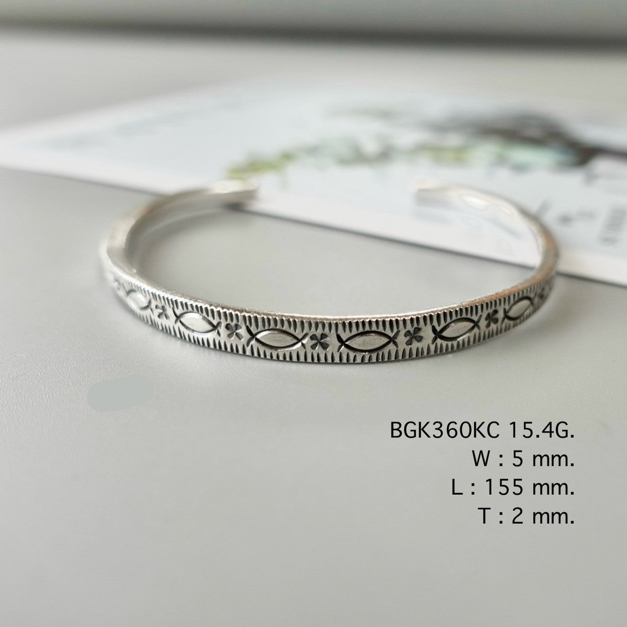 Wear your story in a silver bangle.