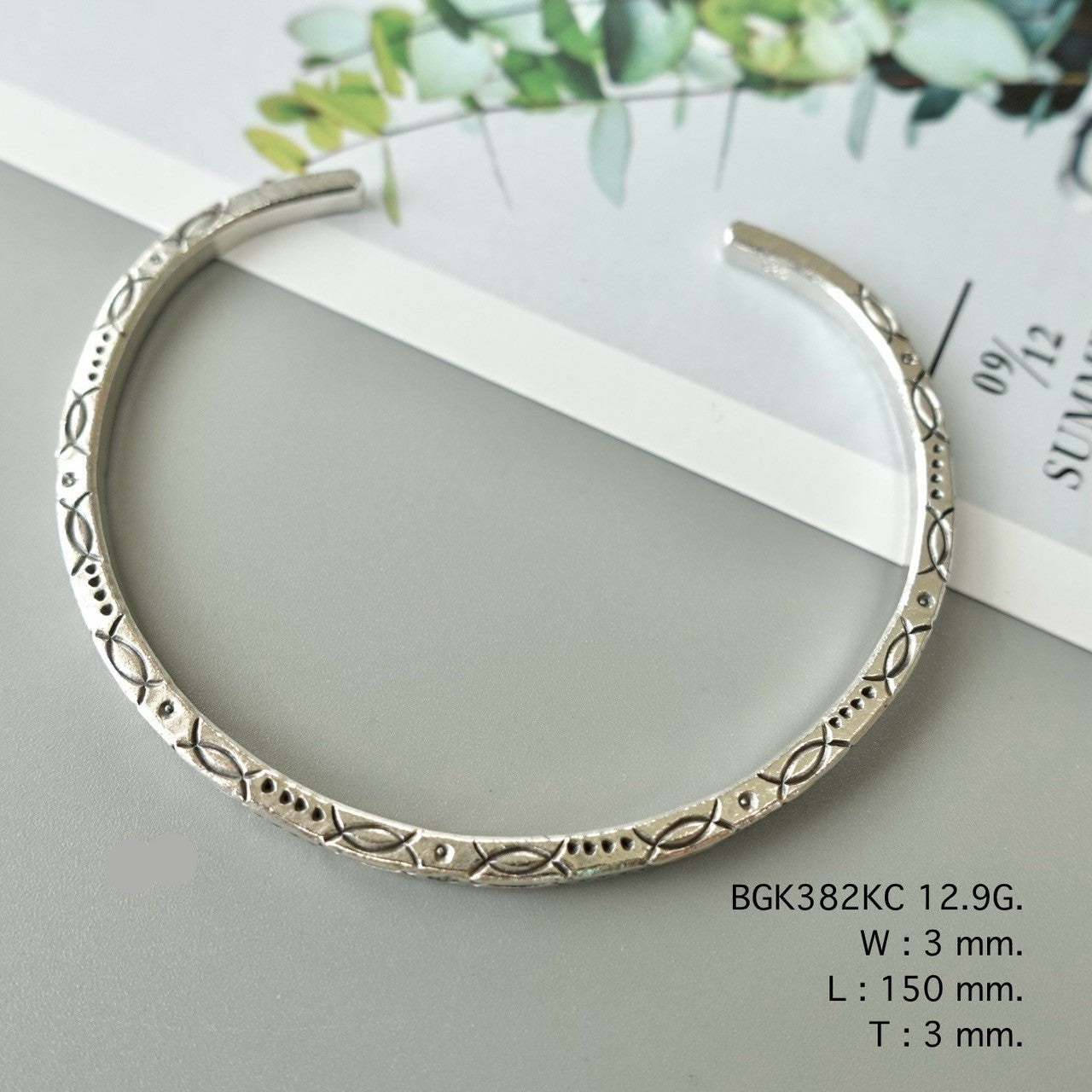 Light on the wrist, rich in charm — bangle.