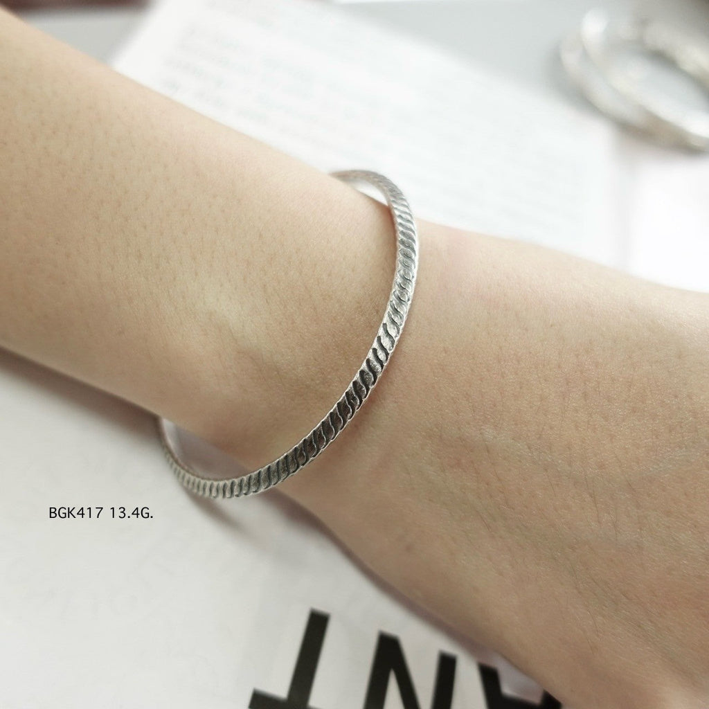 Silver bangle. Statement silver. Handcrafted power.