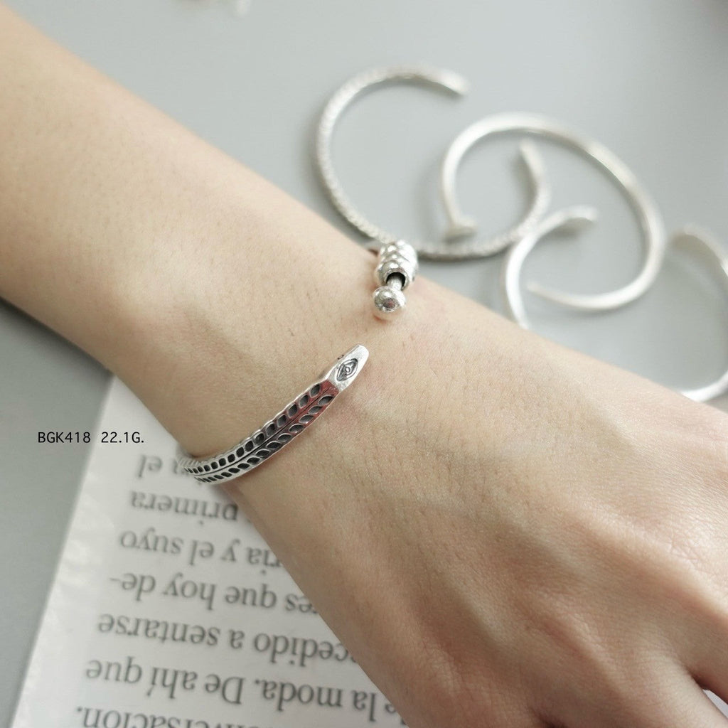 Silver bangle. Luxury, rooted in tradition.