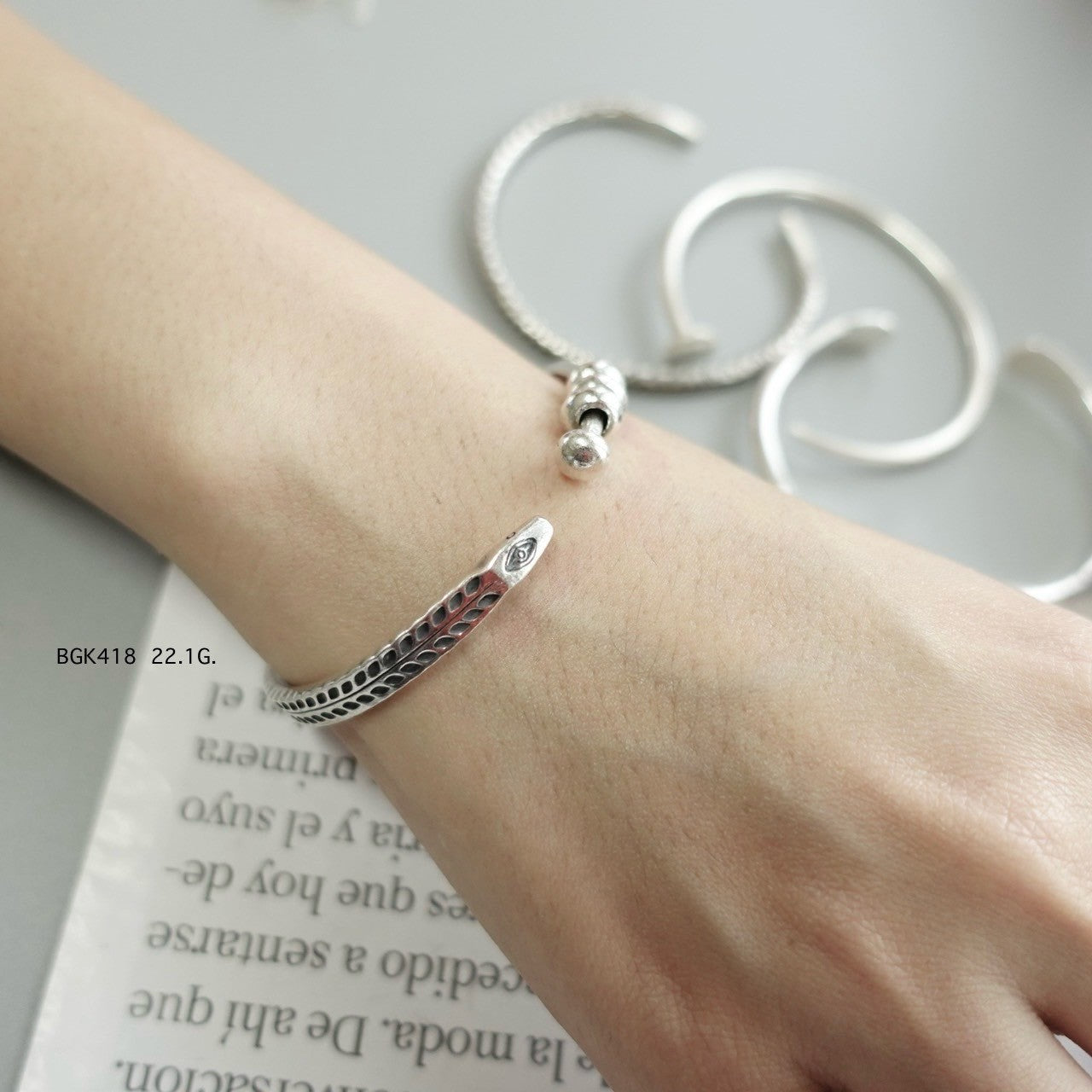 Silver bangle. Luxury, rooted in tradition.
