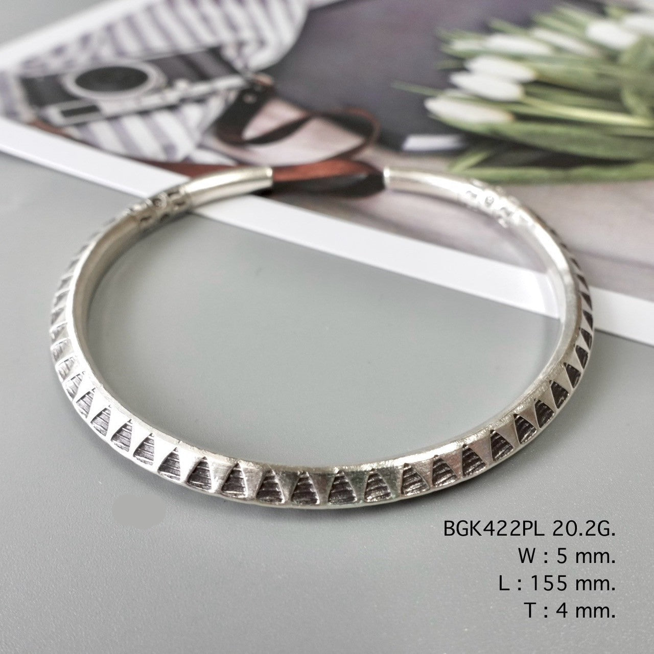 A silver bangle, a forever piece.