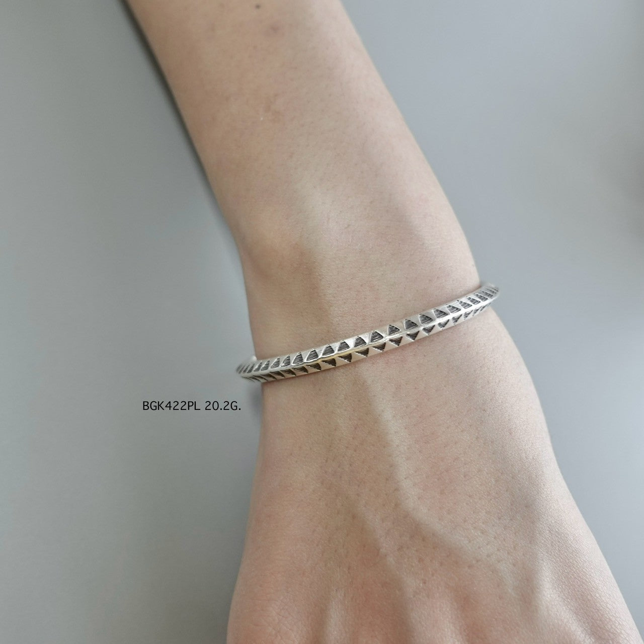 A silver bangle, a forever piece.
