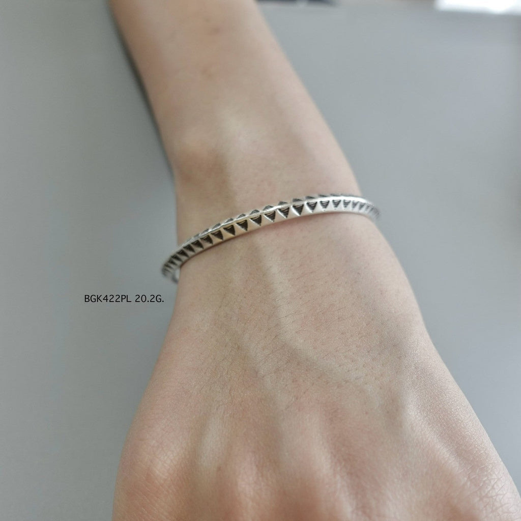 A silver bangle, a forever piece.