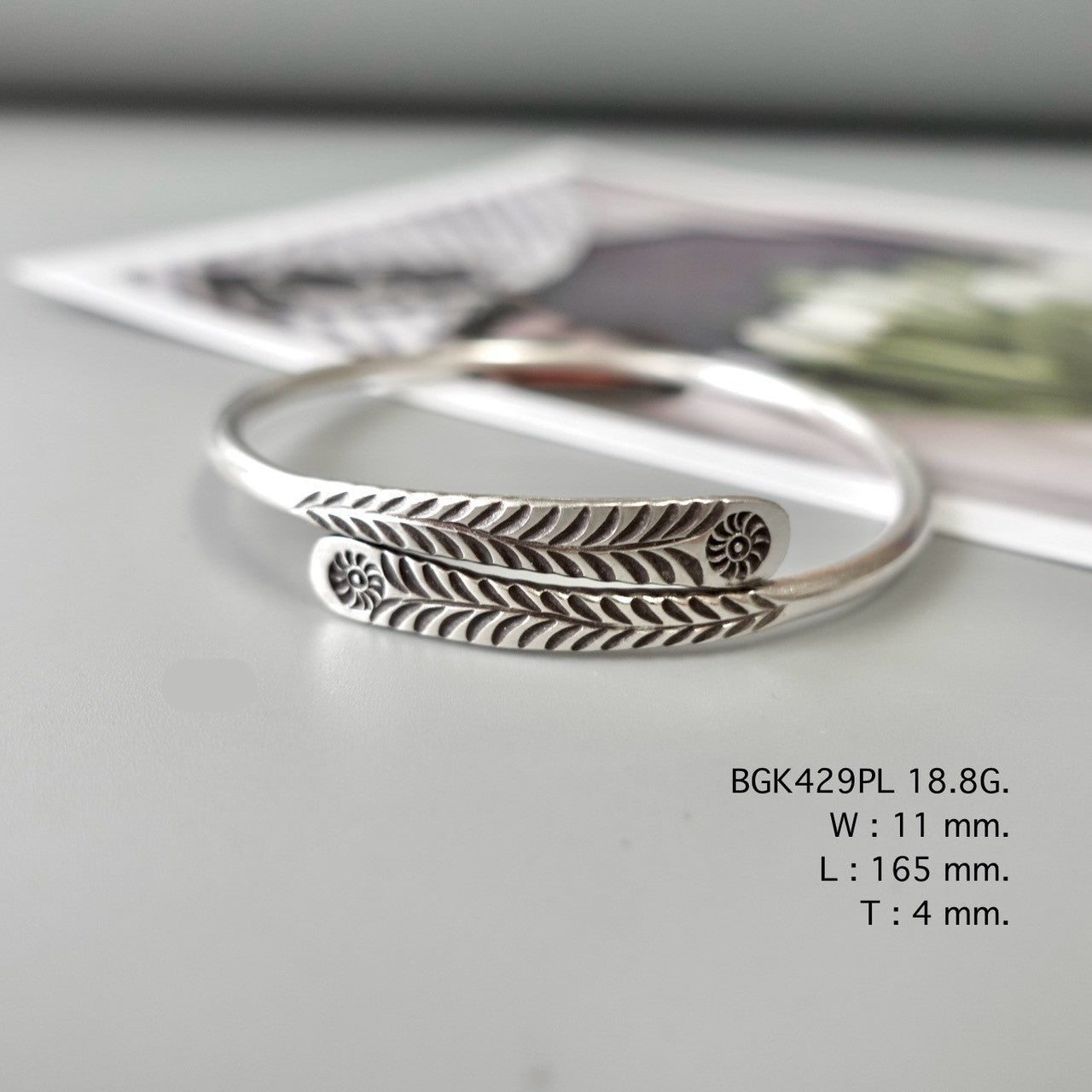 Grace your wrist with a silver bangle.