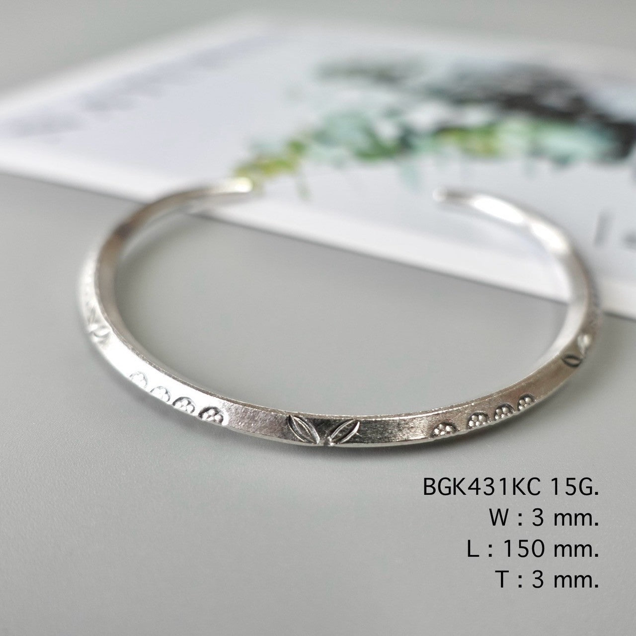 Your shine begins with this silver bangle.