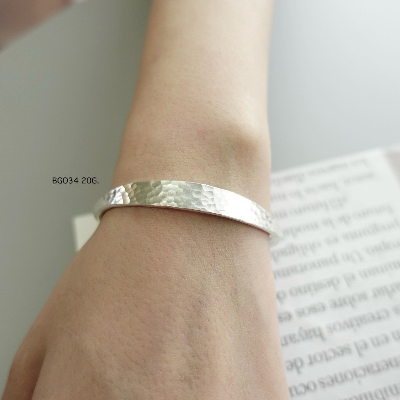 Silver bangle. Crafted to captivate.